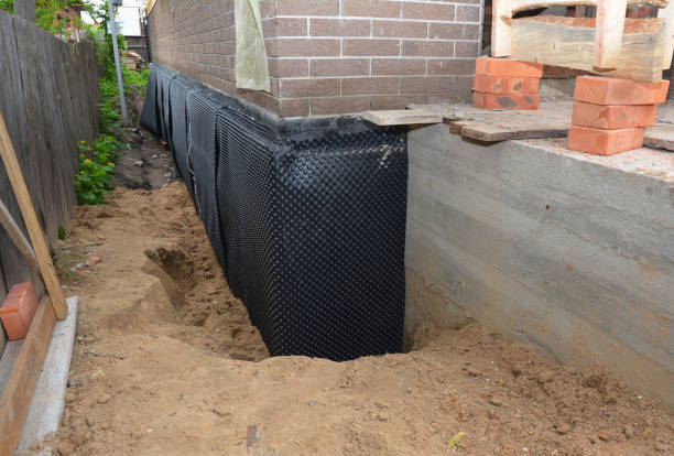 SJ Waterproofing Pros technician performing targeted Basement Waterproofing assessment in Manchester, VA
